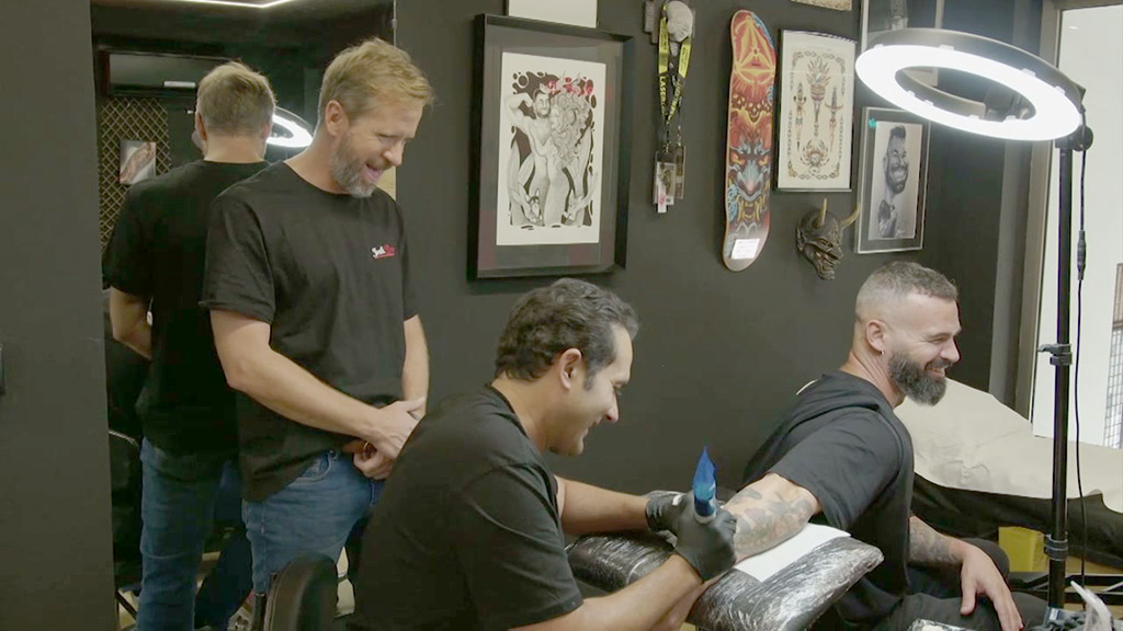 Between cronies |  The famous tattoo artist submits to his students